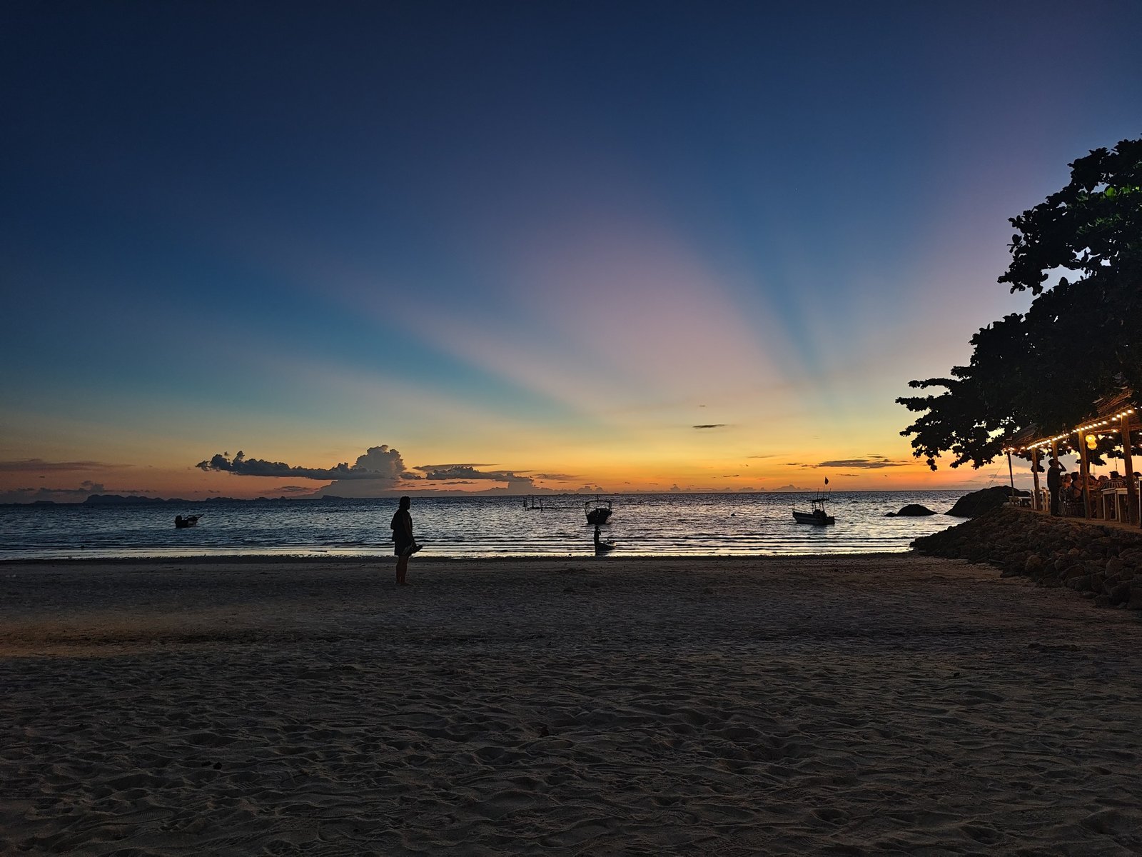 A blue and gold sunset over the sea, photographed during the founder's June 2026 trip